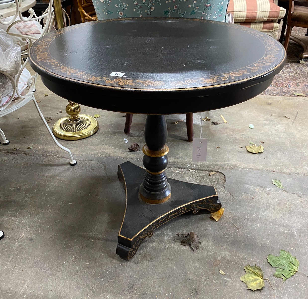 A Regency design painted parcel gilt circular centre table, diameter 74cm, height 71cm